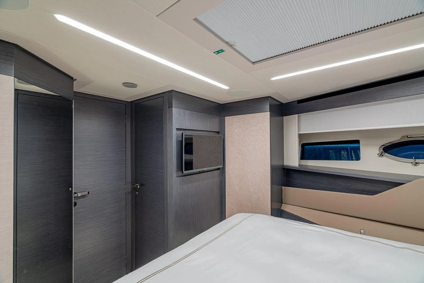 a room with a bed and a television aboard SILVER BULLET Yacht for Sale