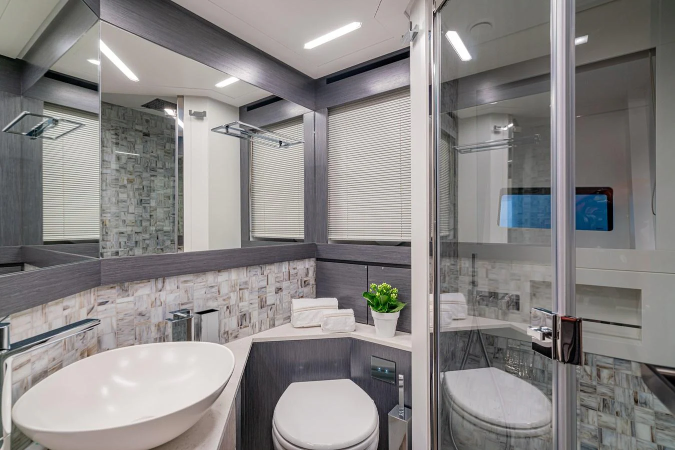 a bathroom with a glass shower aboard SILVER BULLET Yacht for Sale