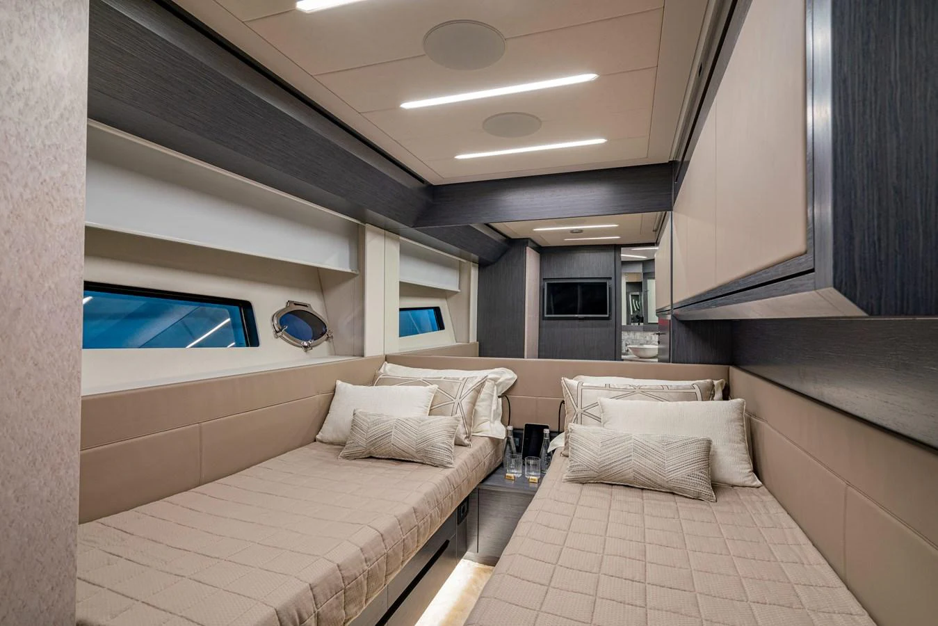 a room with a bed and a television aboard SILVER BULLET Yacht for Sale