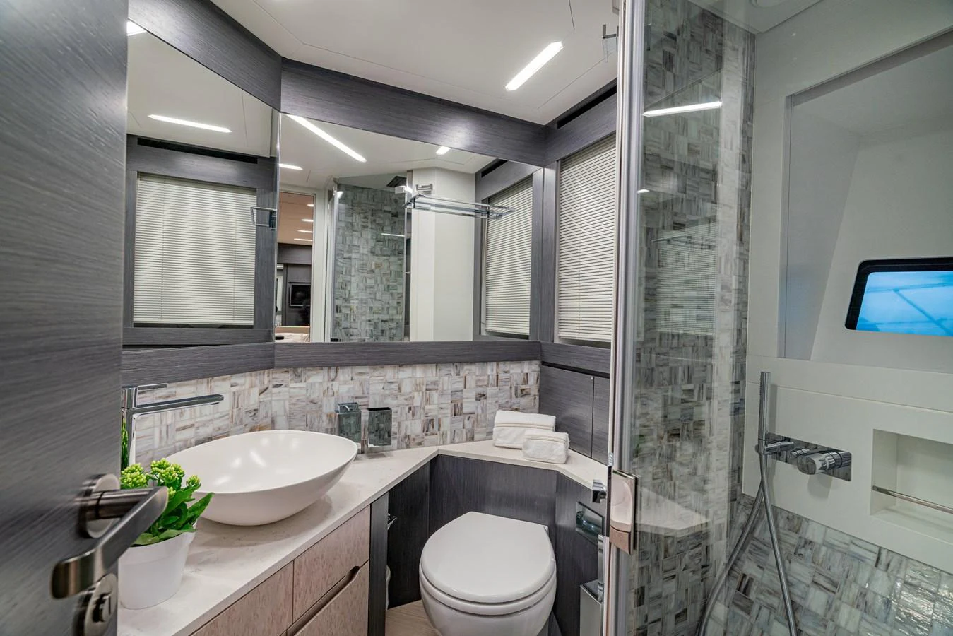 a bathroom with a sink and a toilet aboard SILVER BULLET Yacht for Sale