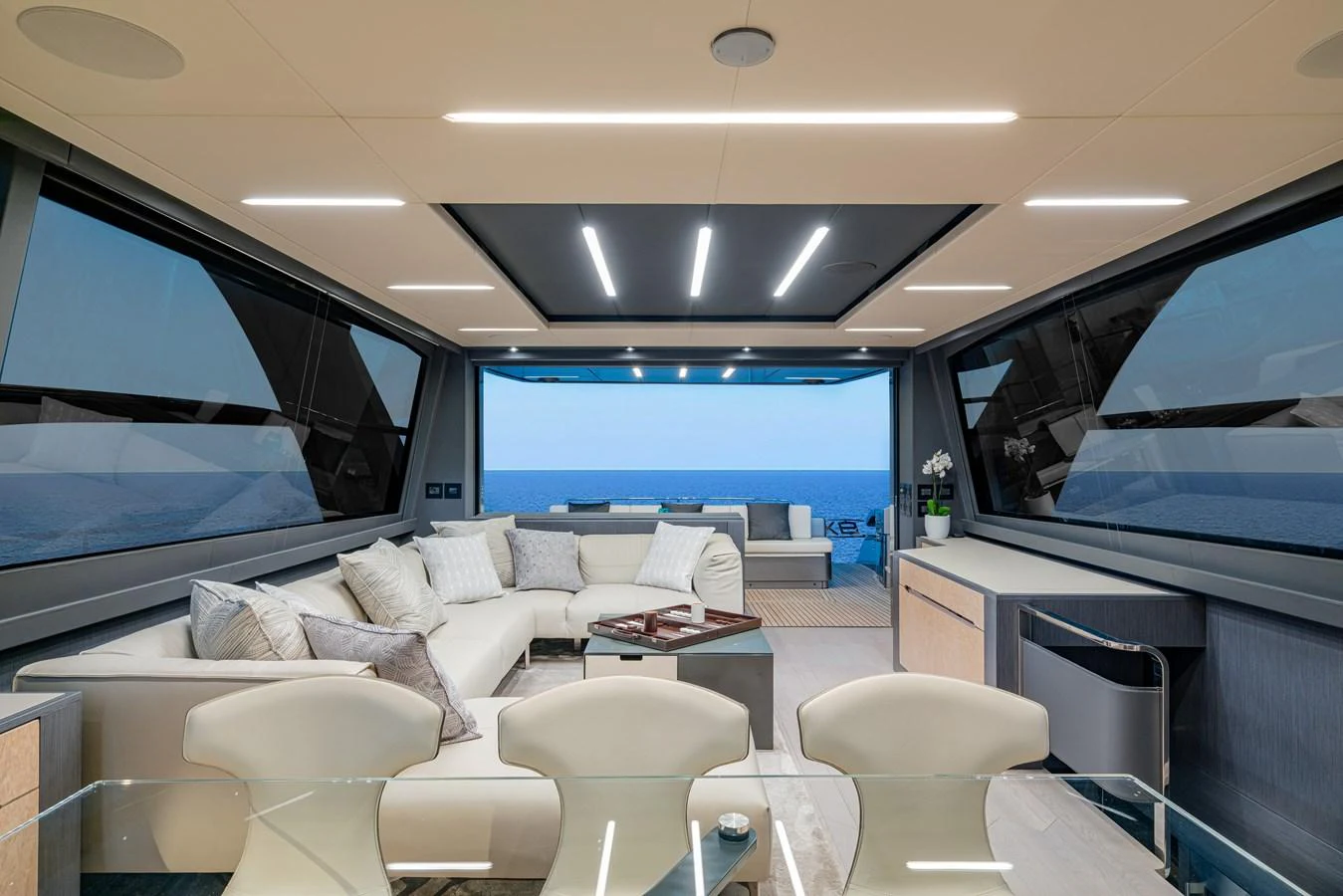 a room with a couch and a table and a window aboard SILVER BULLET Yacht for Sale