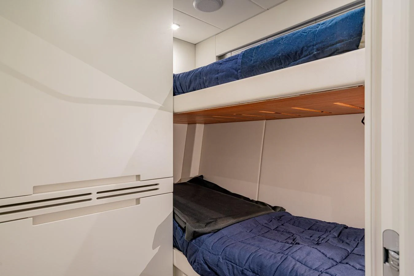 a room with a bed and a window aboard SILVER BULLET Yacht for Sale
