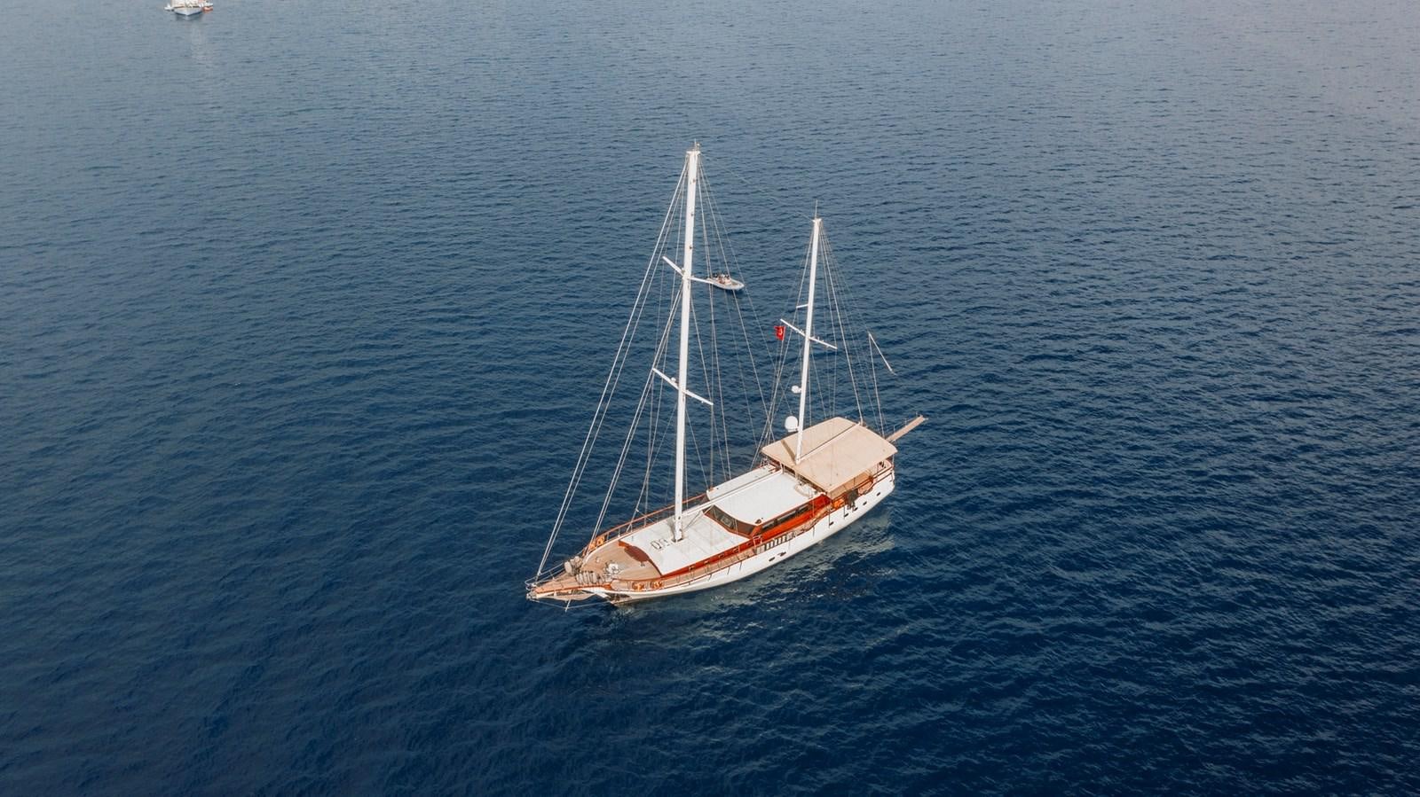 a boat in the water aboard CUSTOM MADE MOTORSAILER Yacht for Sale