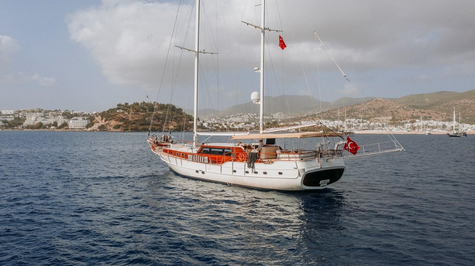 a boat on the water aboard CUSTOM MADE MOTORSAILER Yacht for Sale