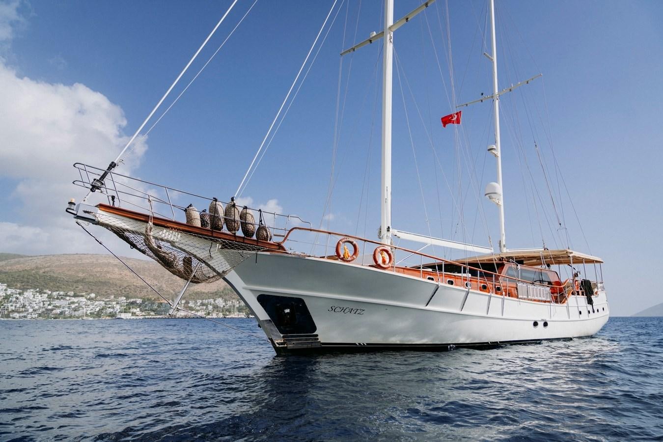 a boat on the water aboard CUSTOM MADE MOTORSAILER Yacht for Sale