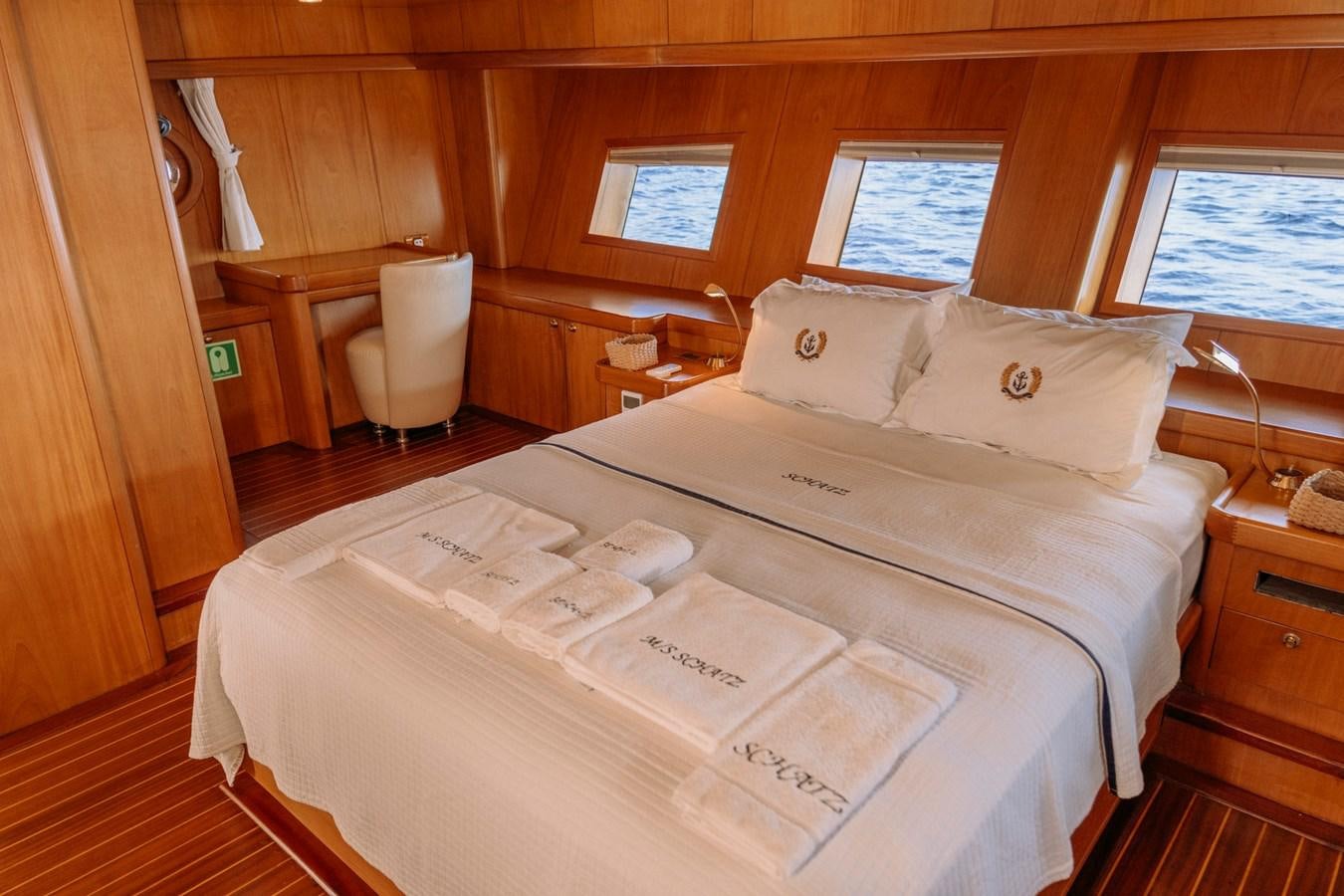 a bed with white sheets aboard CUSTOM MADE MOTORSAILER Yacht for Sale