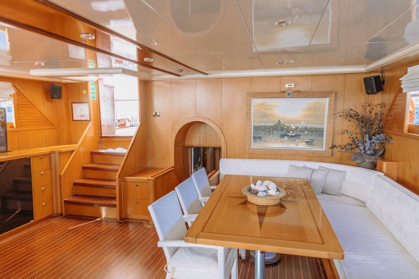 a room with a couch and a table aboard CUSTOM MADE MOTORSAILER Yacht for Sale