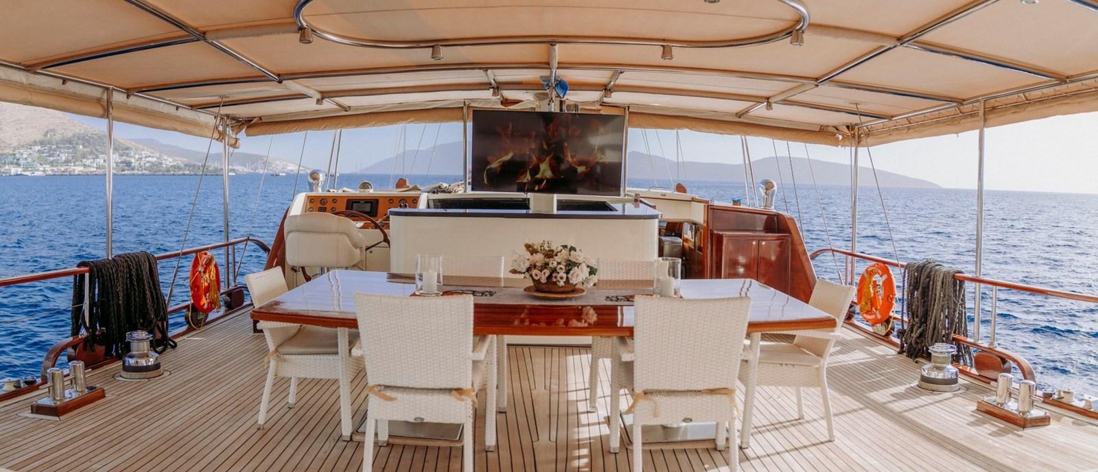 a boat on the water aboard CUSTOM MADE MOTORSAILER Yacht for Sale