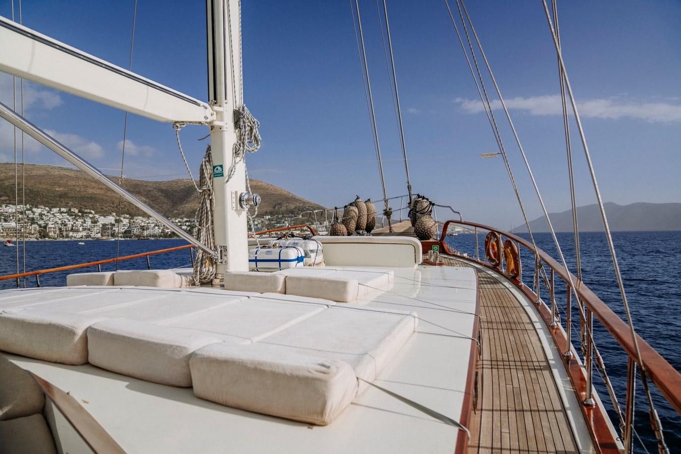 a boat with people on it aboard CUSTOM MADE MOTORSAILER Yacht for Sale