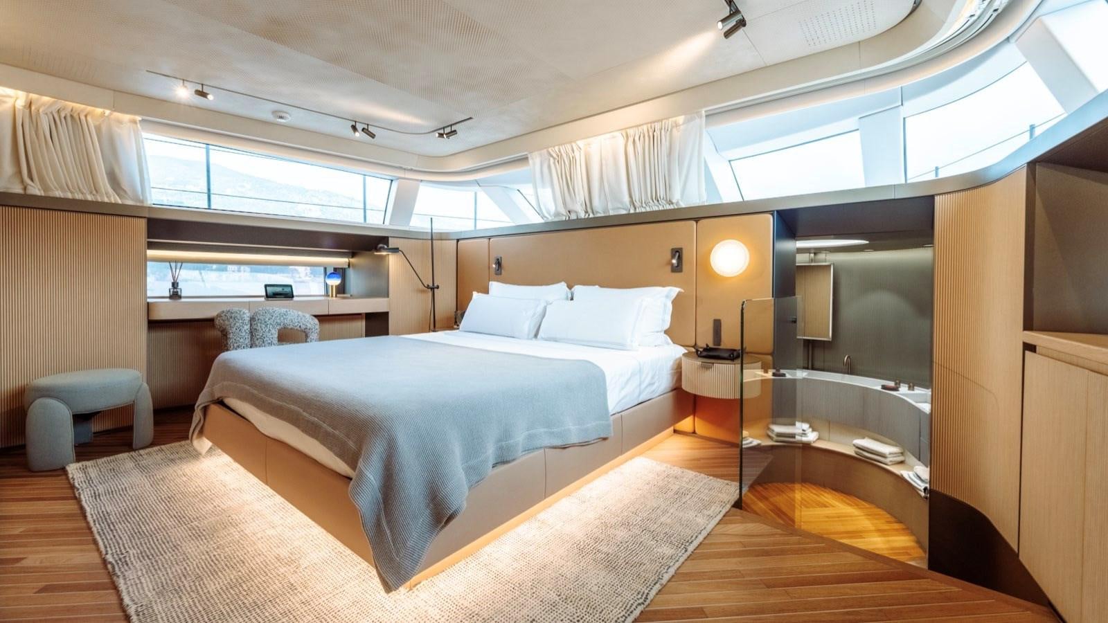 a room with a bed and a chair aboard SAL Yacht for Sale