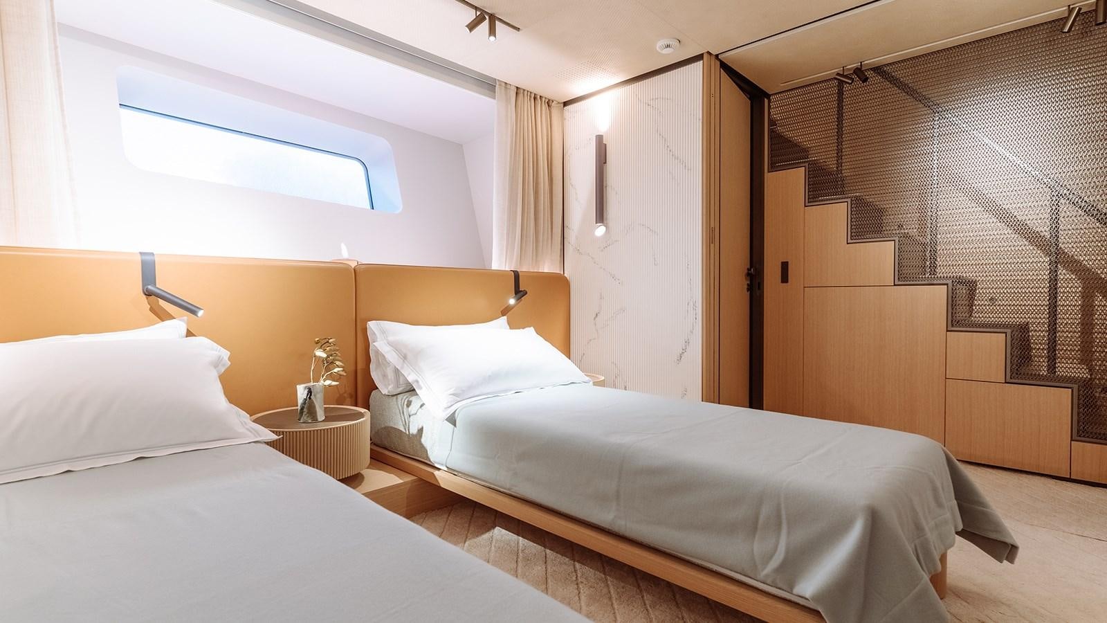 a room with two beds aboard SAL Yacht for Sale