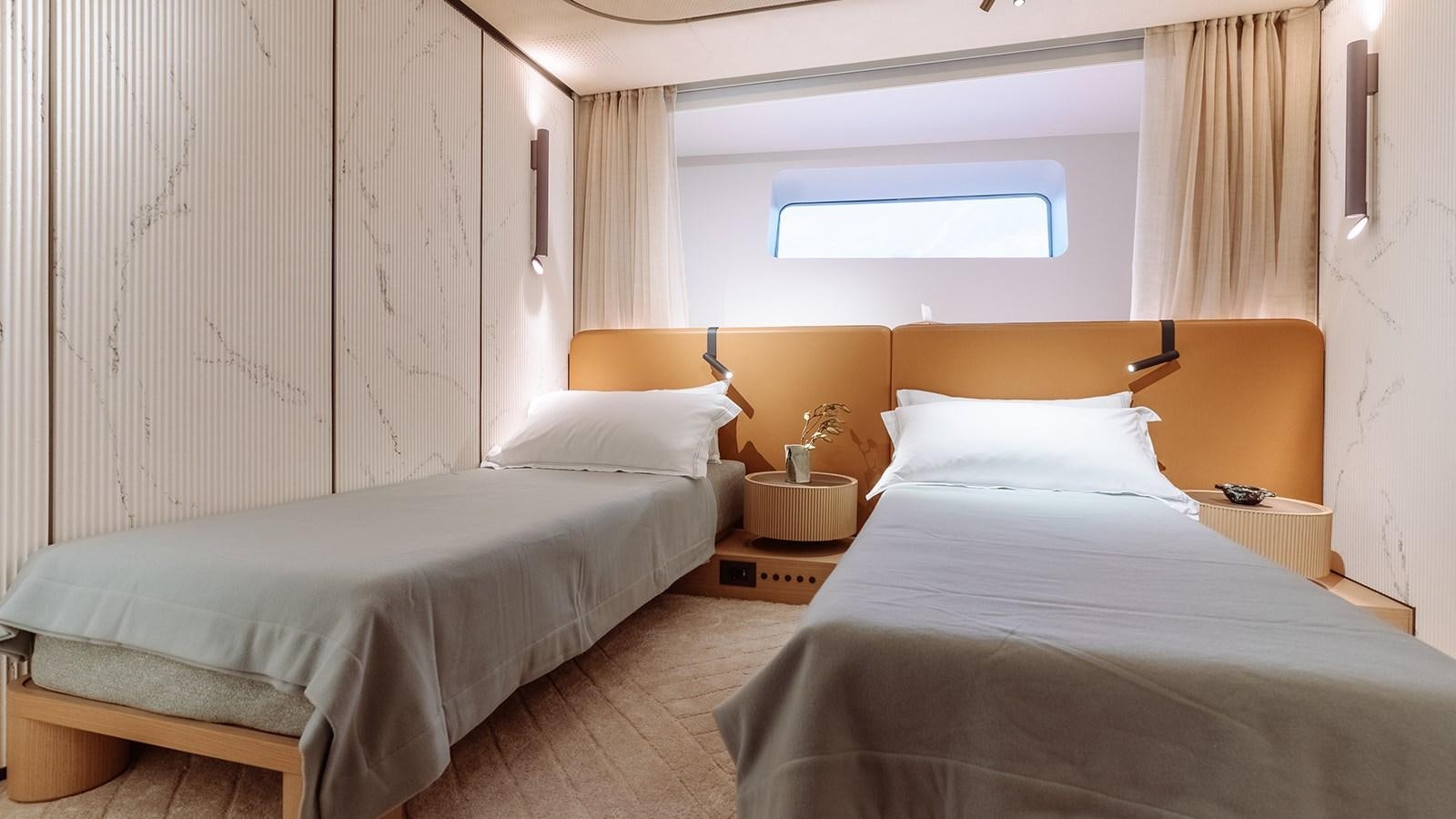 a room with two beds aboard SAL Yacht for Sale