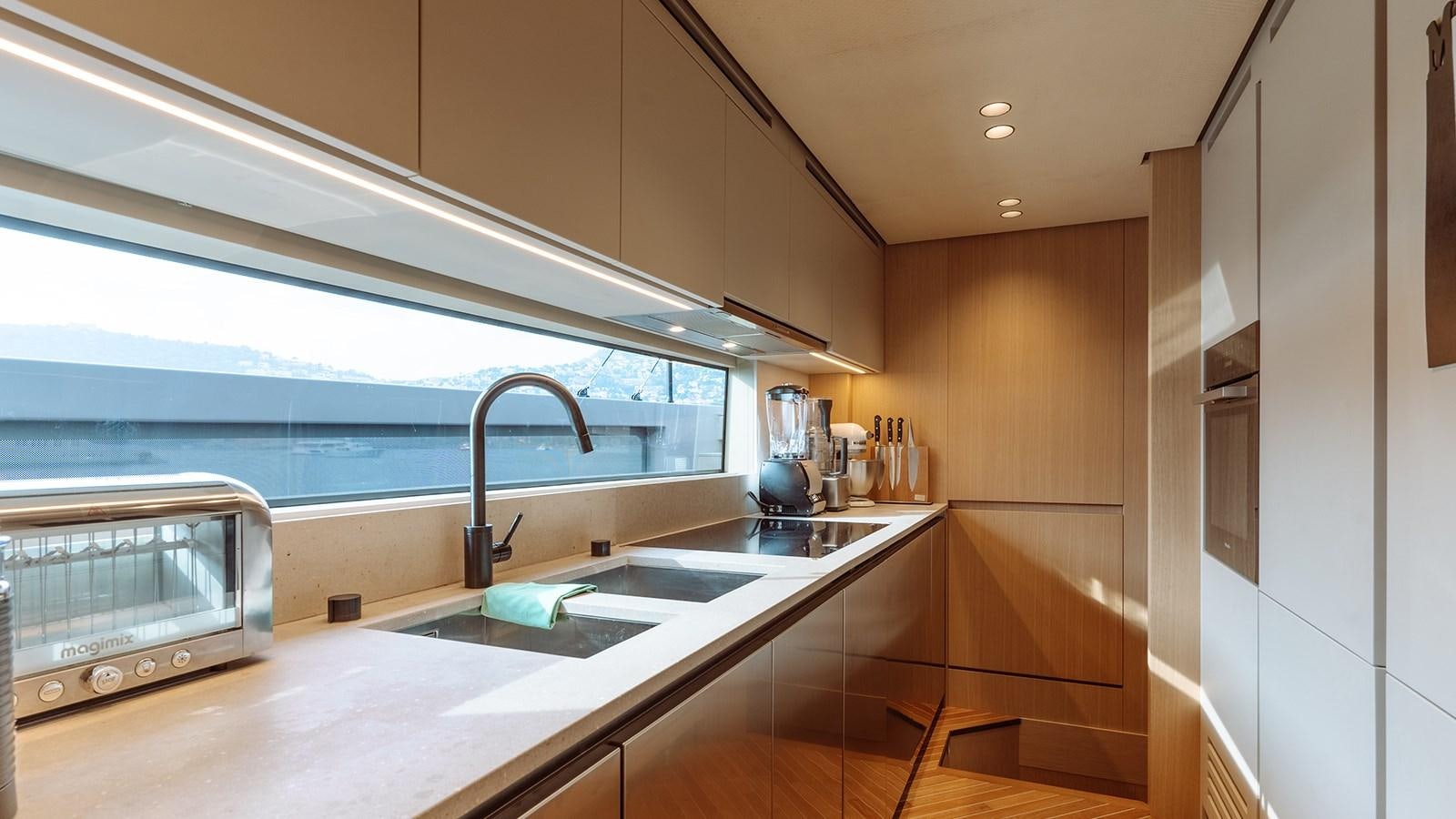 a kitchen with a sink and a window aboard SAL Yacht for Sale