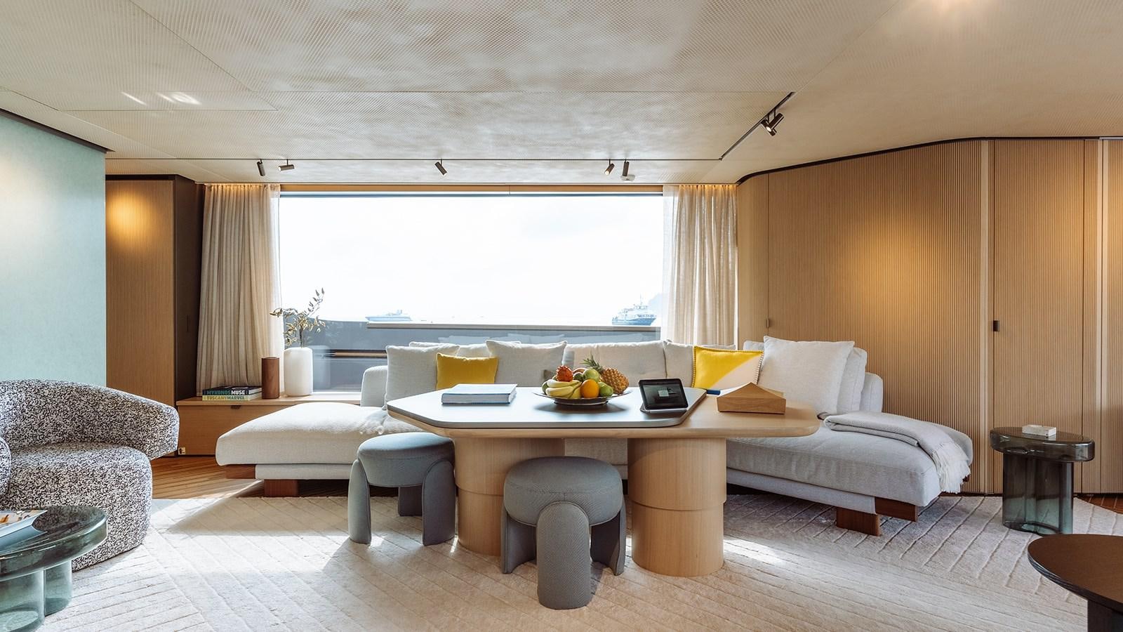 a living room with a couch and a table aboard SAL Yacht for Sale