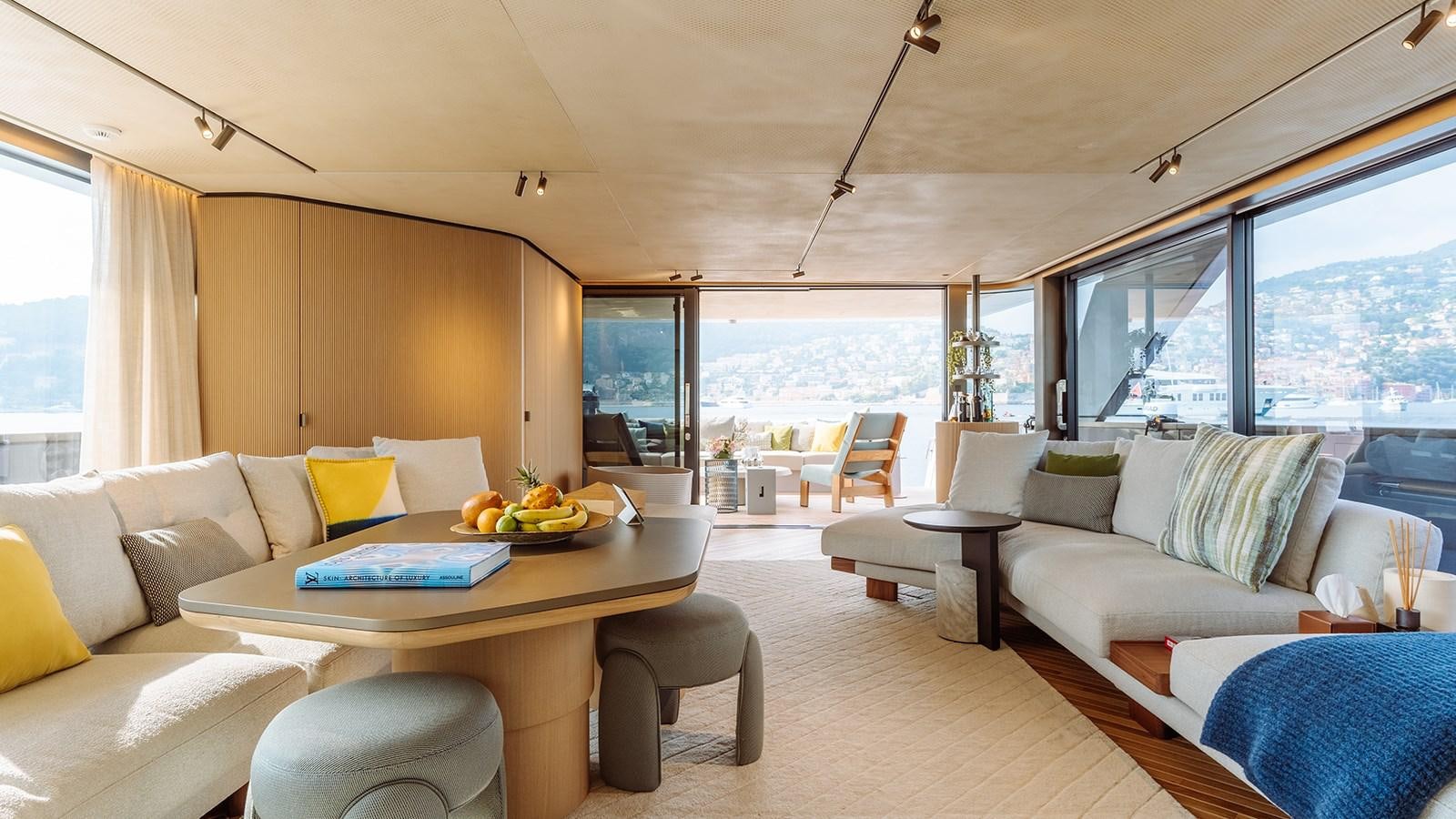 a living room with a couch and a table aboard SAL Yacht for Sale