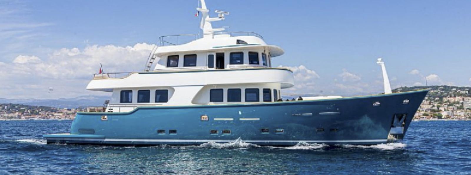 a large white boat in the water aboard T9 Yacht for Sale