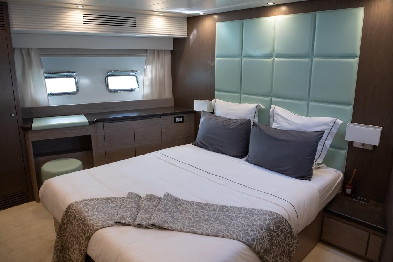 a room with a bed and a window aboard T88 Yacht for Sale