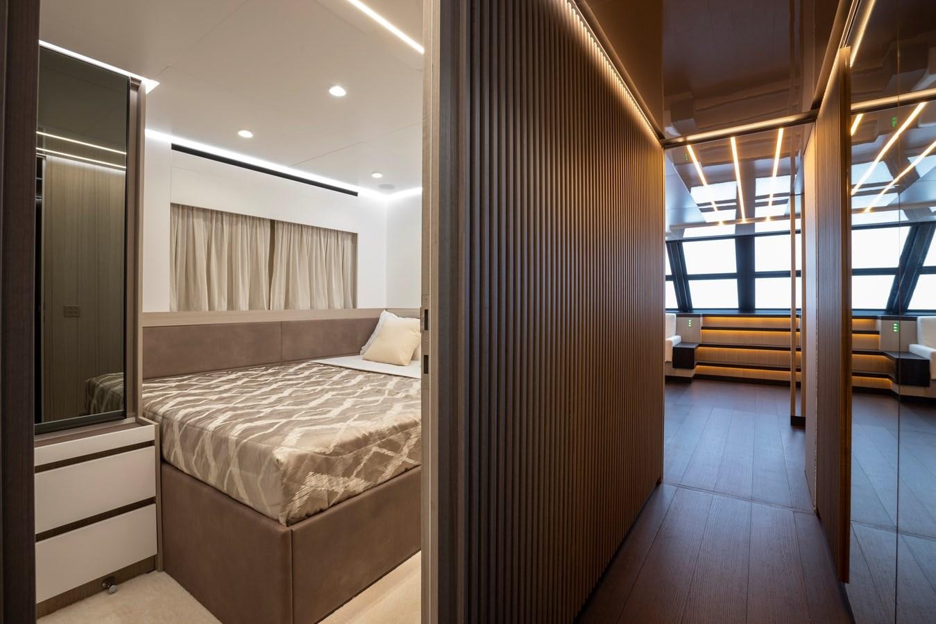 a room with a bed and a wood door aboard S07 SPIDER Yacht for Sale