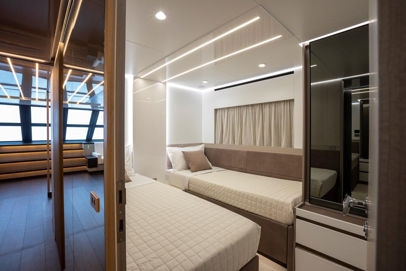 a room with a bed and a mirror aboard S07 SPIDER Yacht for Sale