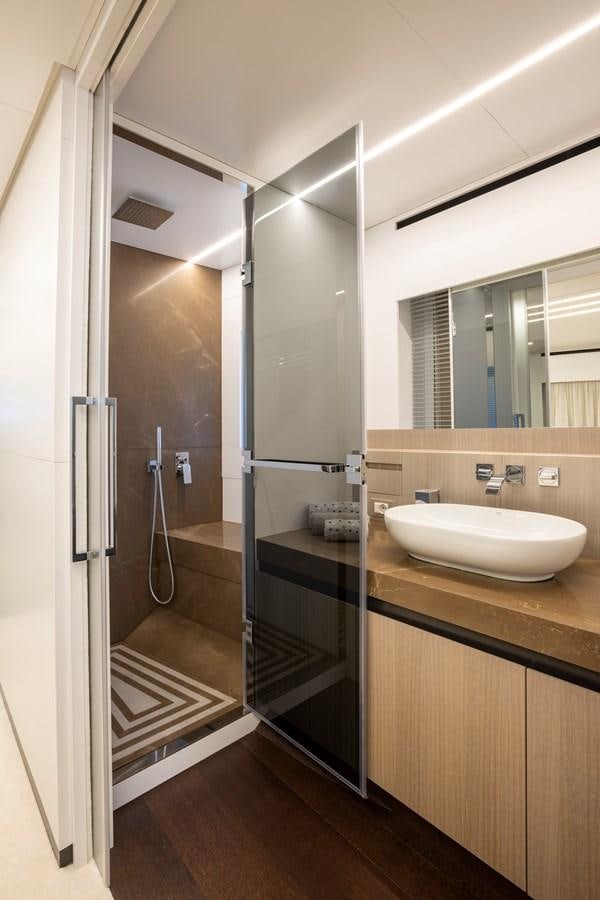 a bathroom with a sink and a shower unit aboard S07 SPIDER Yacht for Sale