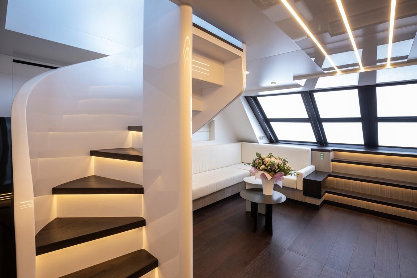 a room with a white staircase and a white couch aboard S07 SPIDER Yacht for Sale