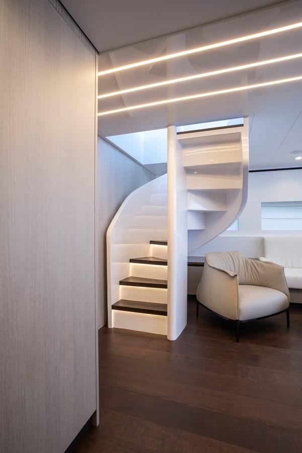 a white stair case in a room aboard S07 SPIDER Yacht for Sale