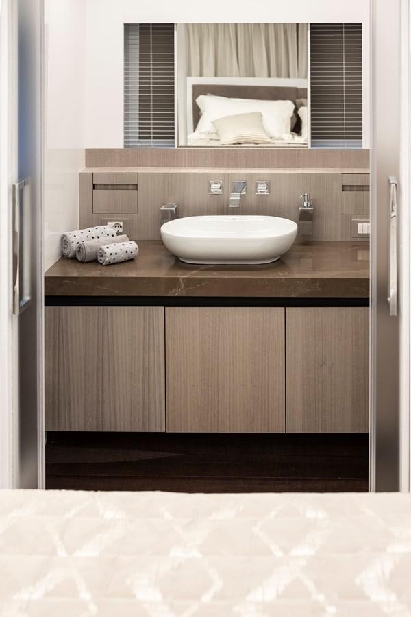 a bathroom with a sink and a mirror aboard S07 SPIDER Yacht for Sale