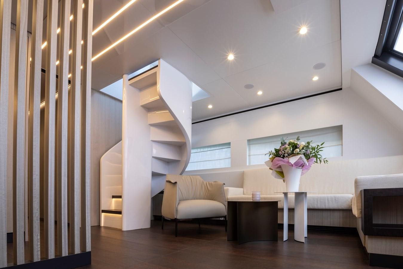 a room with a staircase and a couch aboard S07 SPIDER Yacht for Sale