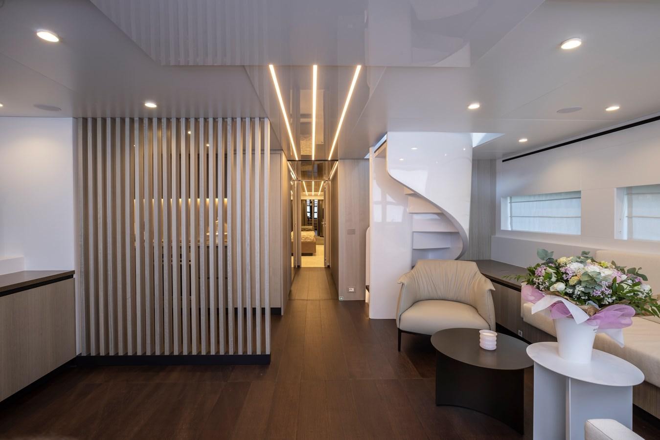 a room with a couch and a table and a lamp aboard S07 SPIDER Yacht for Sale