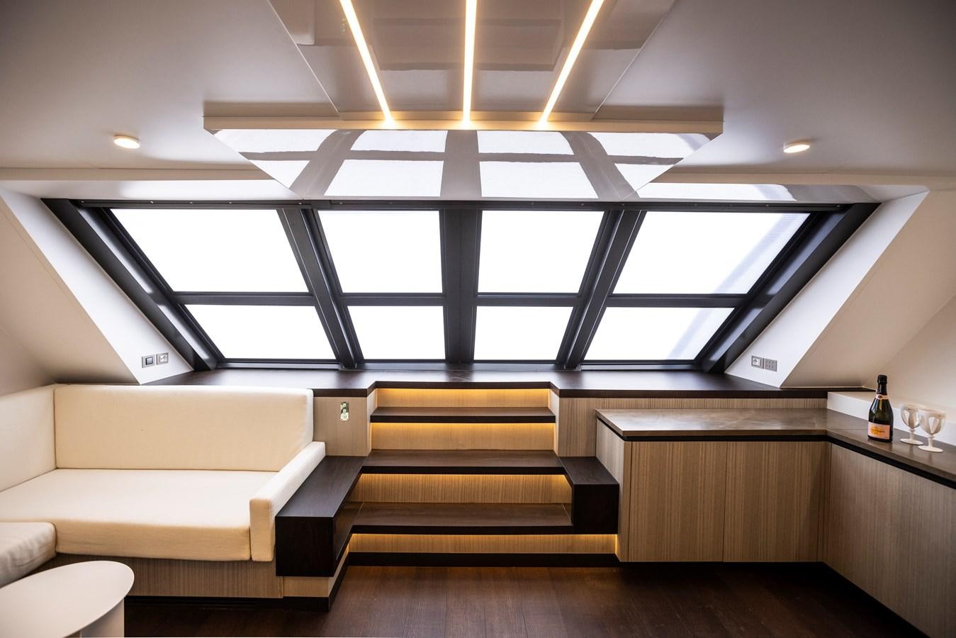 a room with a bench and a glass wall aboard S07 SPIDER Yacht for Sale