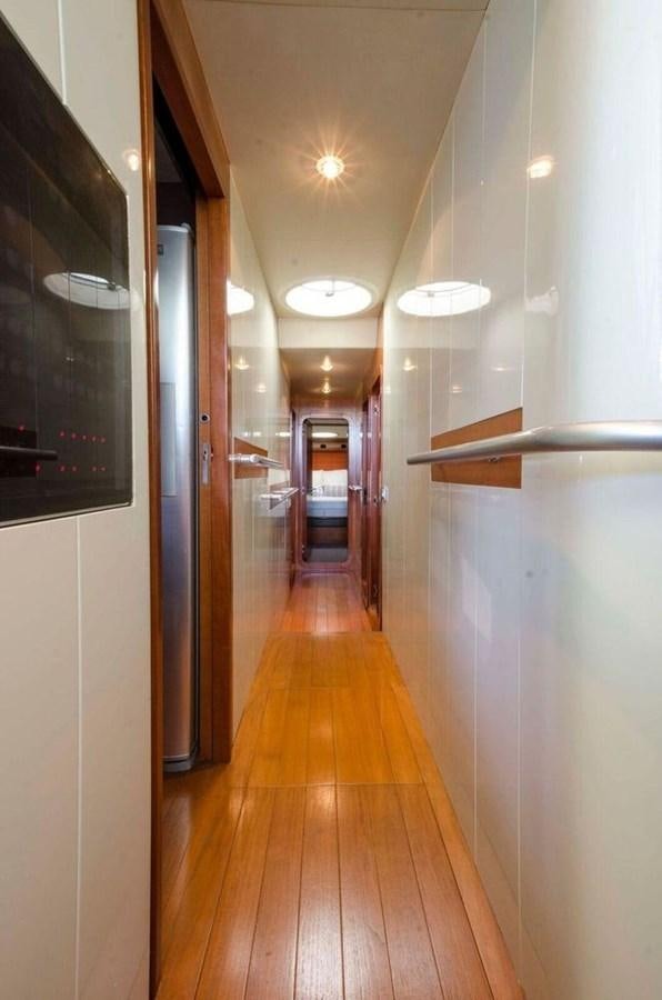 a hallway with doors aboard DIVINE MADNESS Yacht for Sale