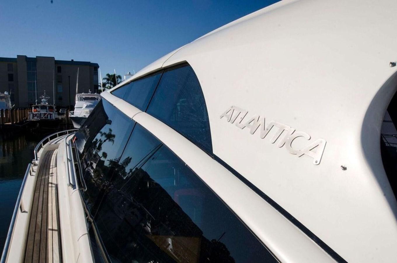 a white car with a logo on the side of it aboard DIVINE MADNESS Yacht for Sale