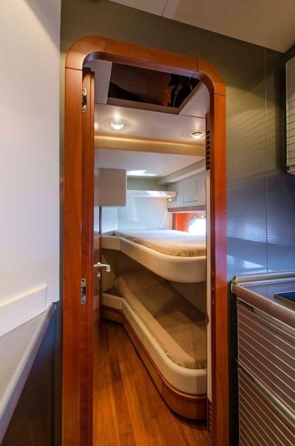a bunk bed in a room aboard DIVINE MADNESS Yacht for Sale