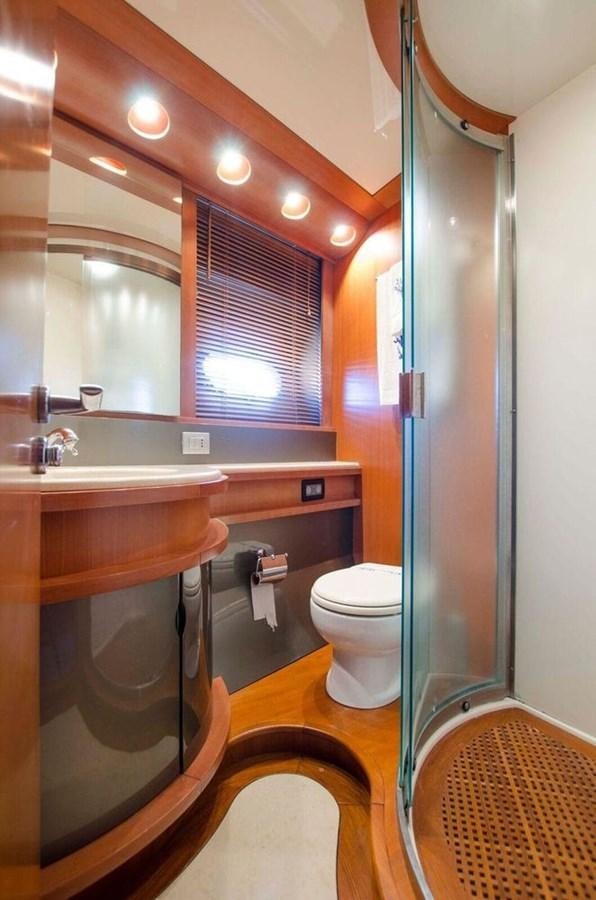 a bathroom with a sink and toilet aboard DIVINE MADNESS Yacht for Sale