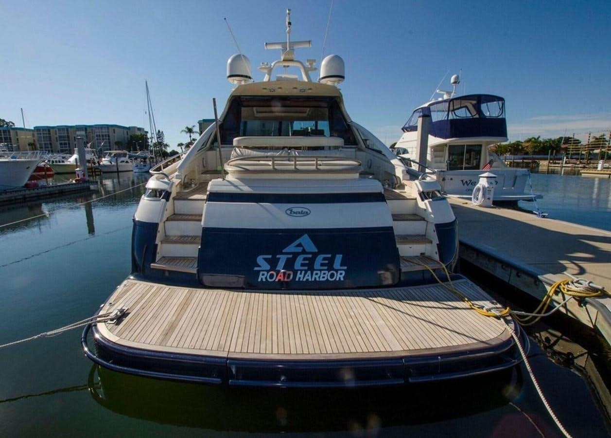a boat docked at a pier aboard DIVINE MADNESS Yacht for Sale