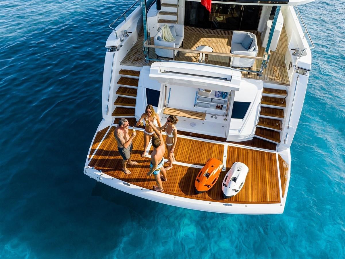 a group of people on a boat aboard SUNSEEKER 88 Yacht for Sale