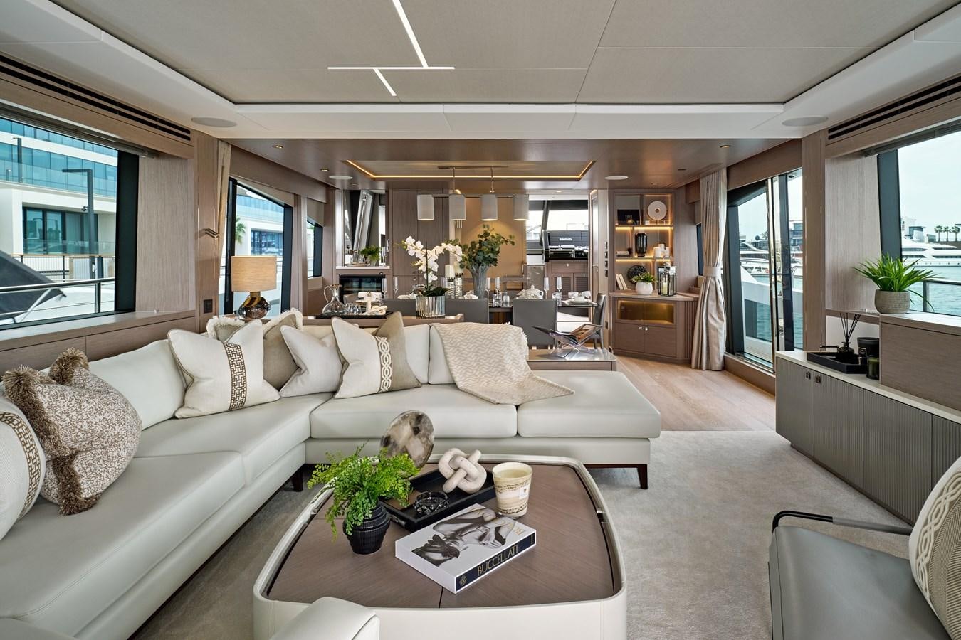 a living room with a white couch and a coffee table aboard SUNSEEKER 88 Yacht for Sale