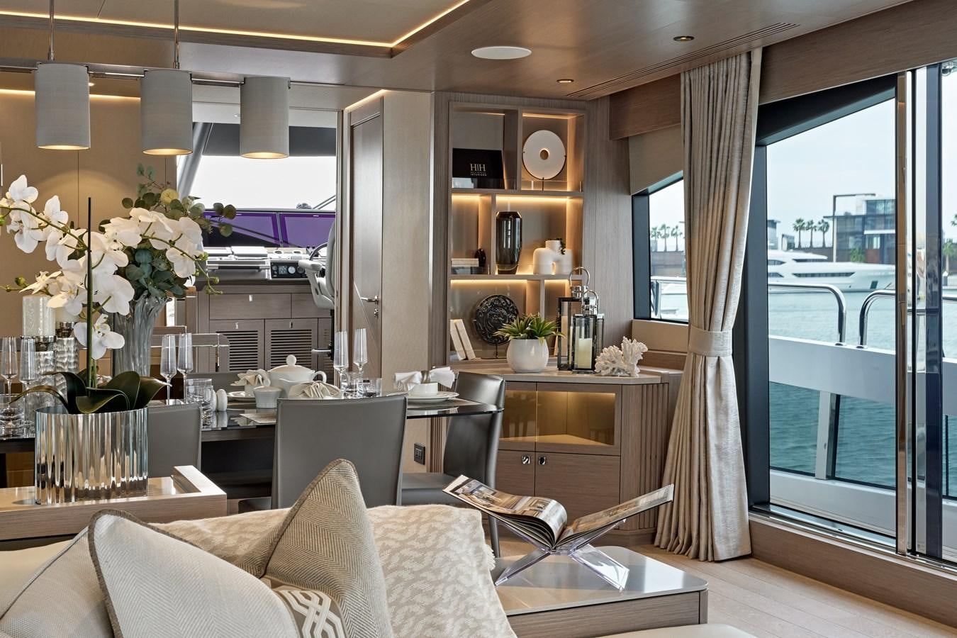 a living room with a large window aboard SUNSEEKER 88 Yacht for Sale