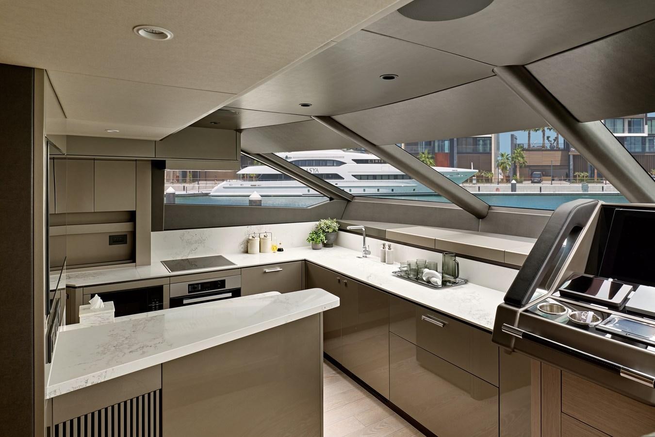 a kitchen with white cabinets aboard SUNSEEKER 88 Yacht for Sale