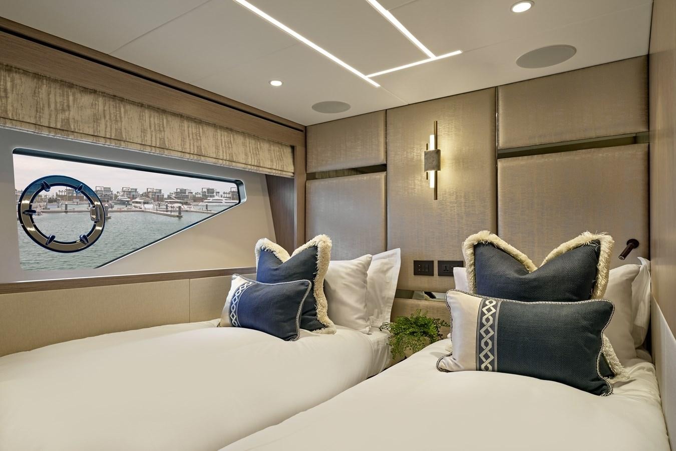 a room with a bed and a painting on the wall aboard SUNSEEKER 88 Yacht for Sale
