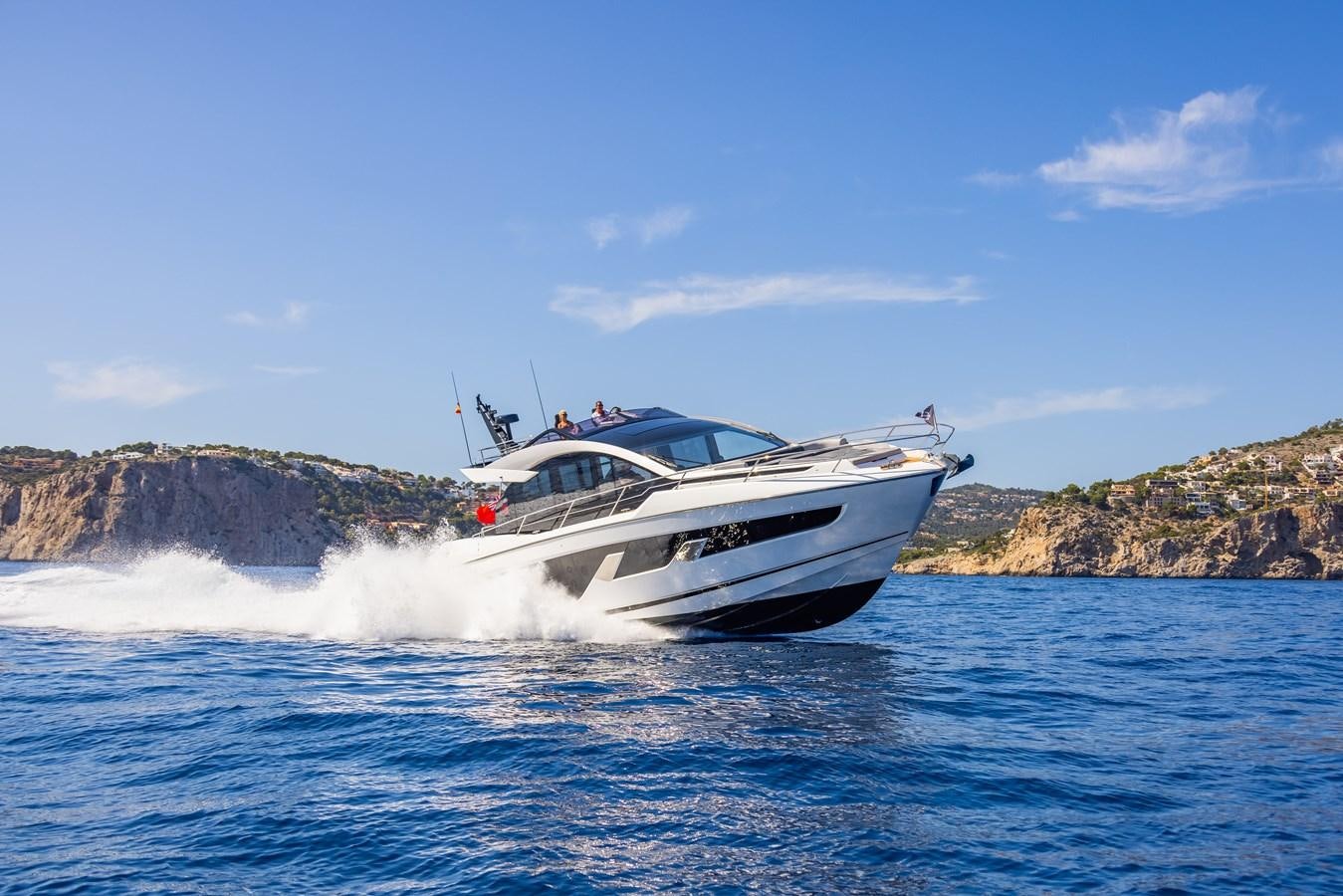 a boat on the water aboard SUNSEEKER 65 SPORTS Yacht for Sale