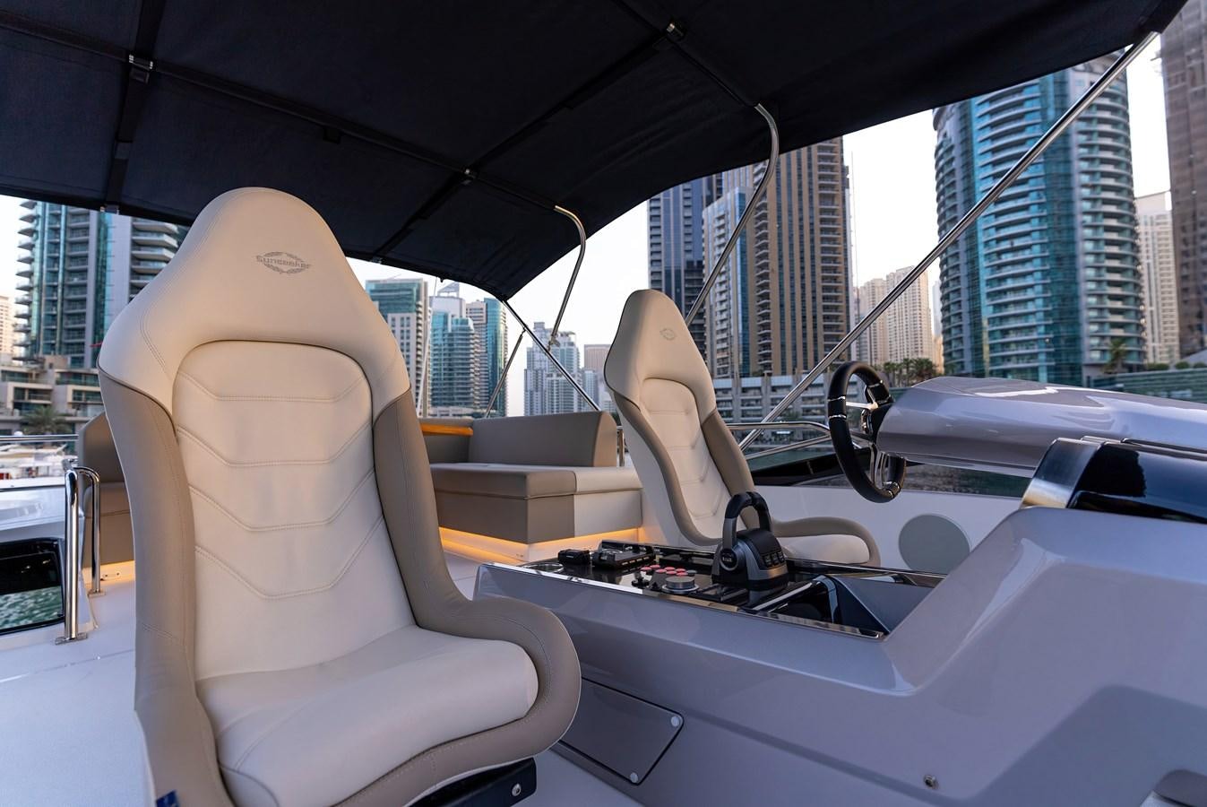 a white car with a black umbrella aboard SUNSEEKER 65 SPORTS Yacht for Sale