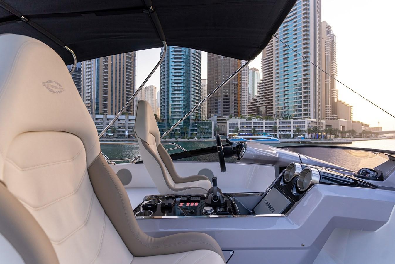 a person driving a boat aboard SUNSEEKER 65 SPORTS Yacht for Sale