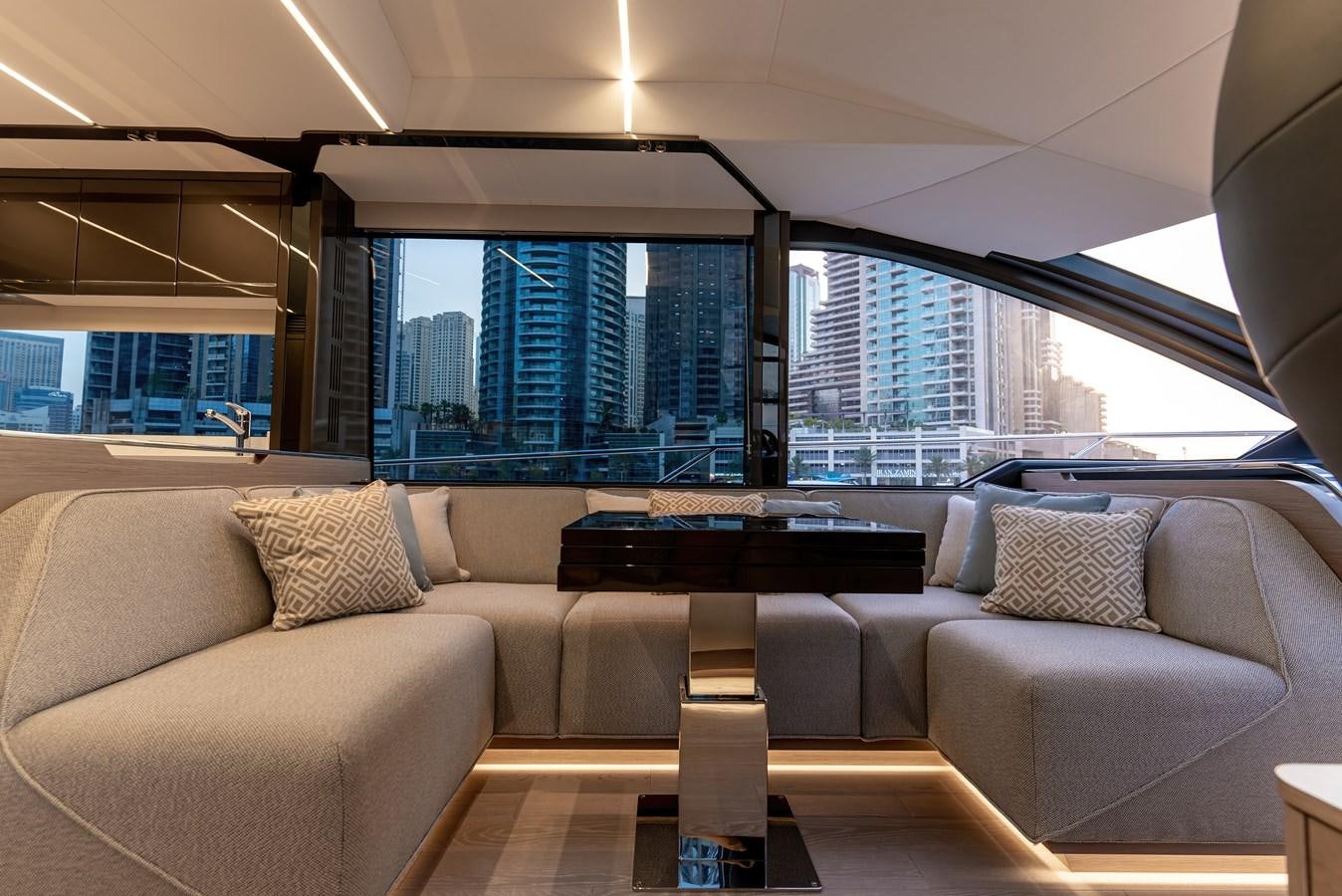 a living room with couches and a table aboard SUNSEEKER 65 SPORTS Yacht for Sale