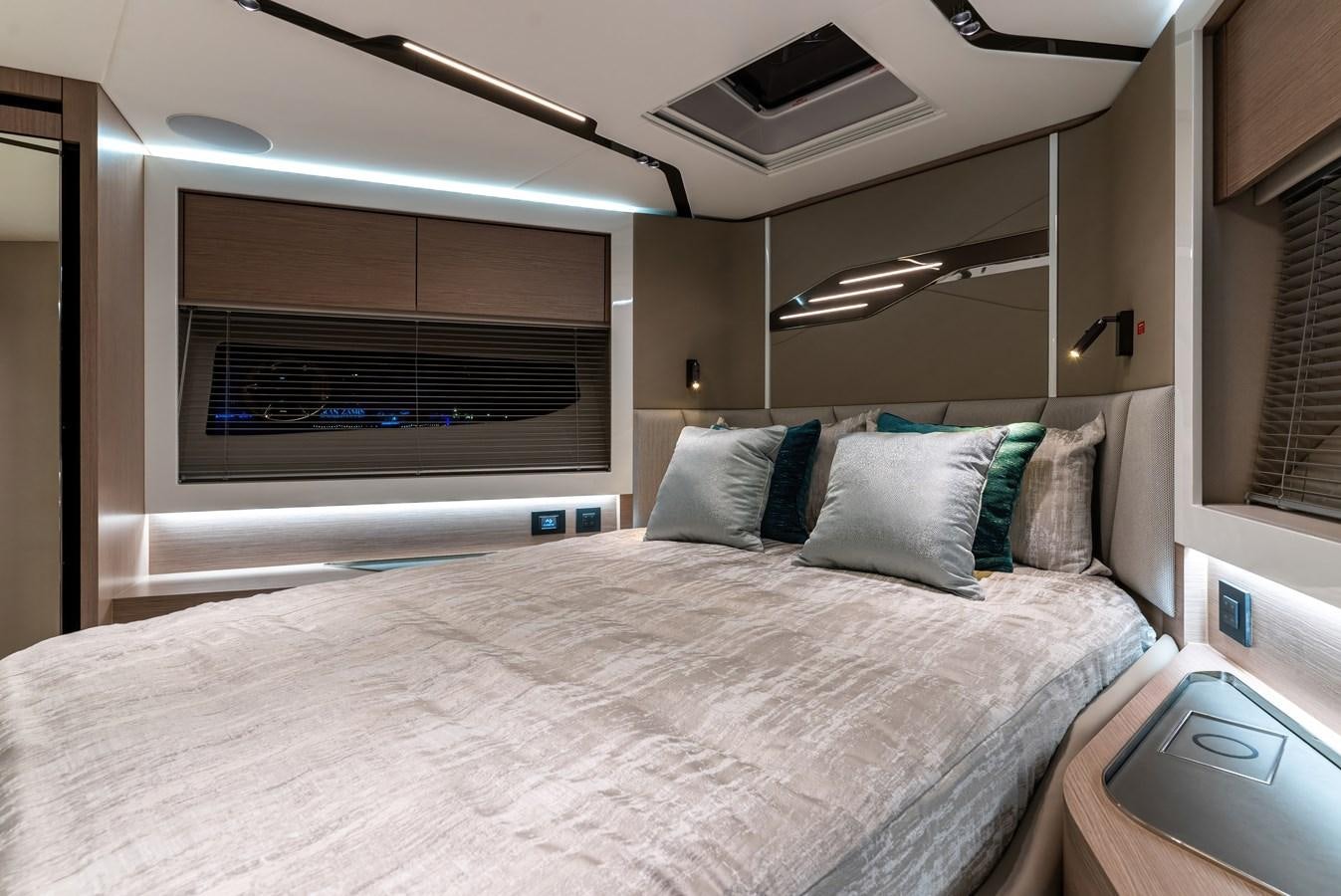 a bed with a white sheet aboard SUNSEEKER 65 SPORTS Yacht for Sale