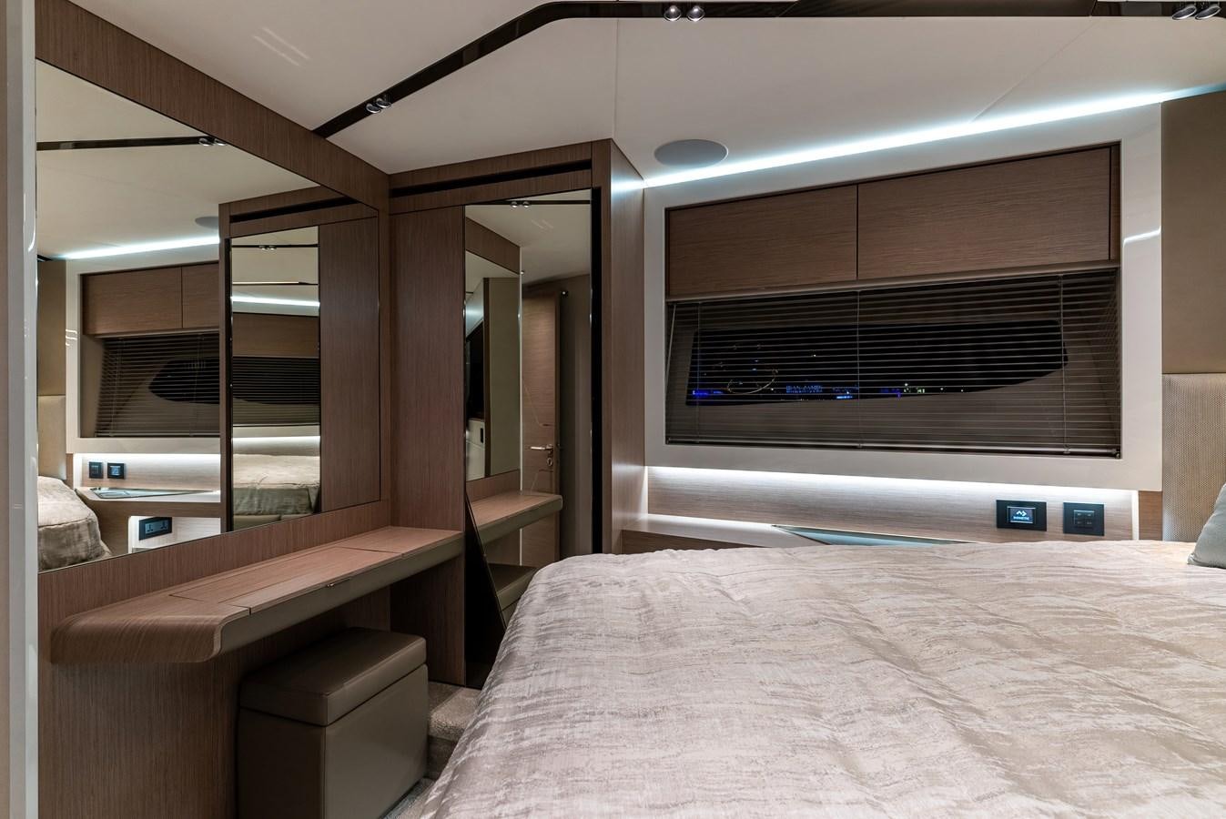 a room with a bed and a television aboard SUNSEEKER 65 SPORTS Yacht for Sale