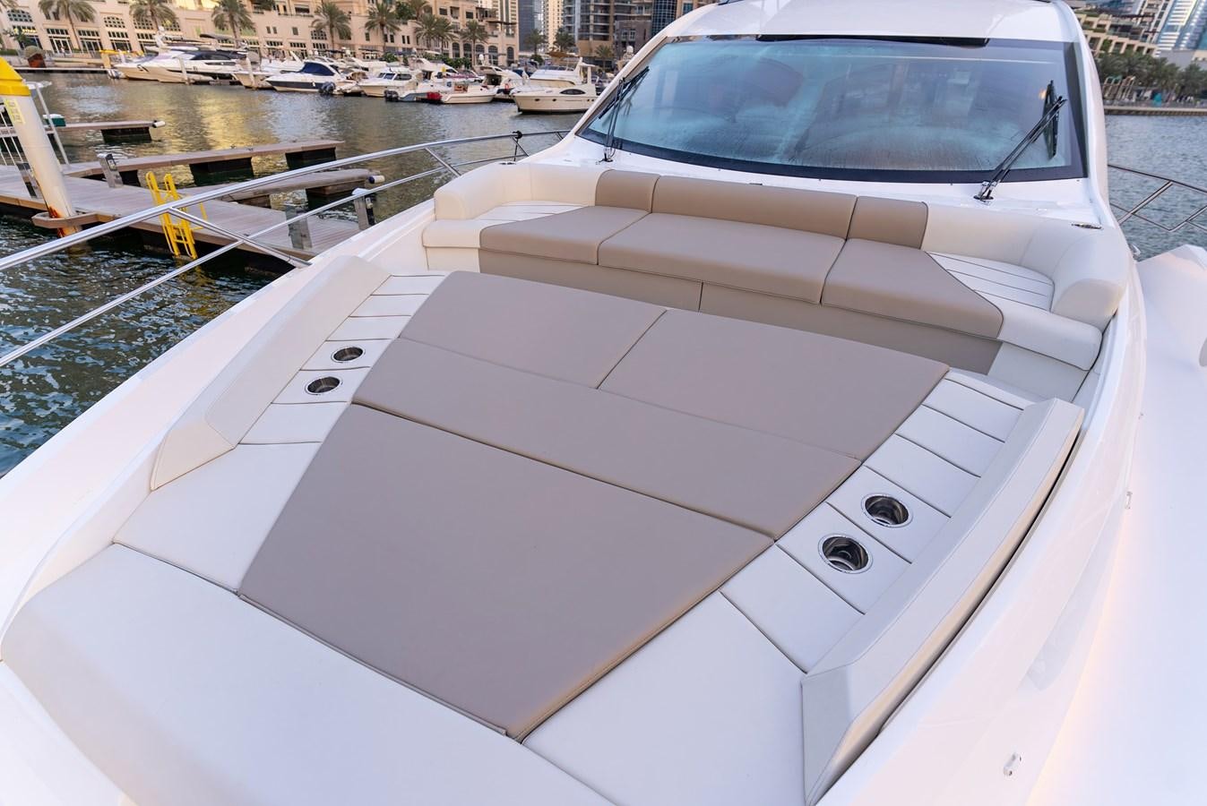 a white car on a boat aboard SUNSEEKER 65 SPORTS Yacht for Sale