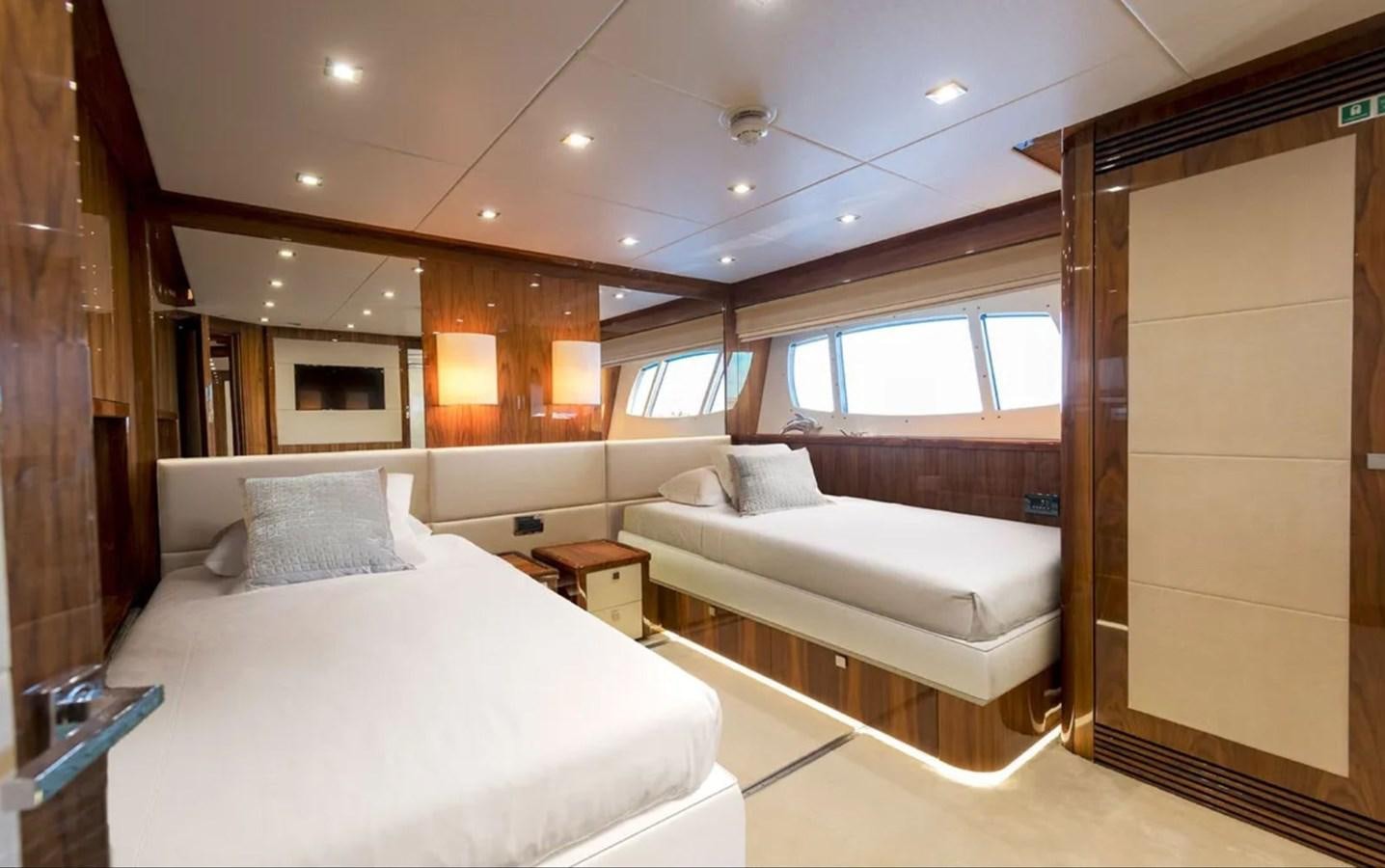 a room with a bed and a mirror aboard ANYA Yacht for Sale