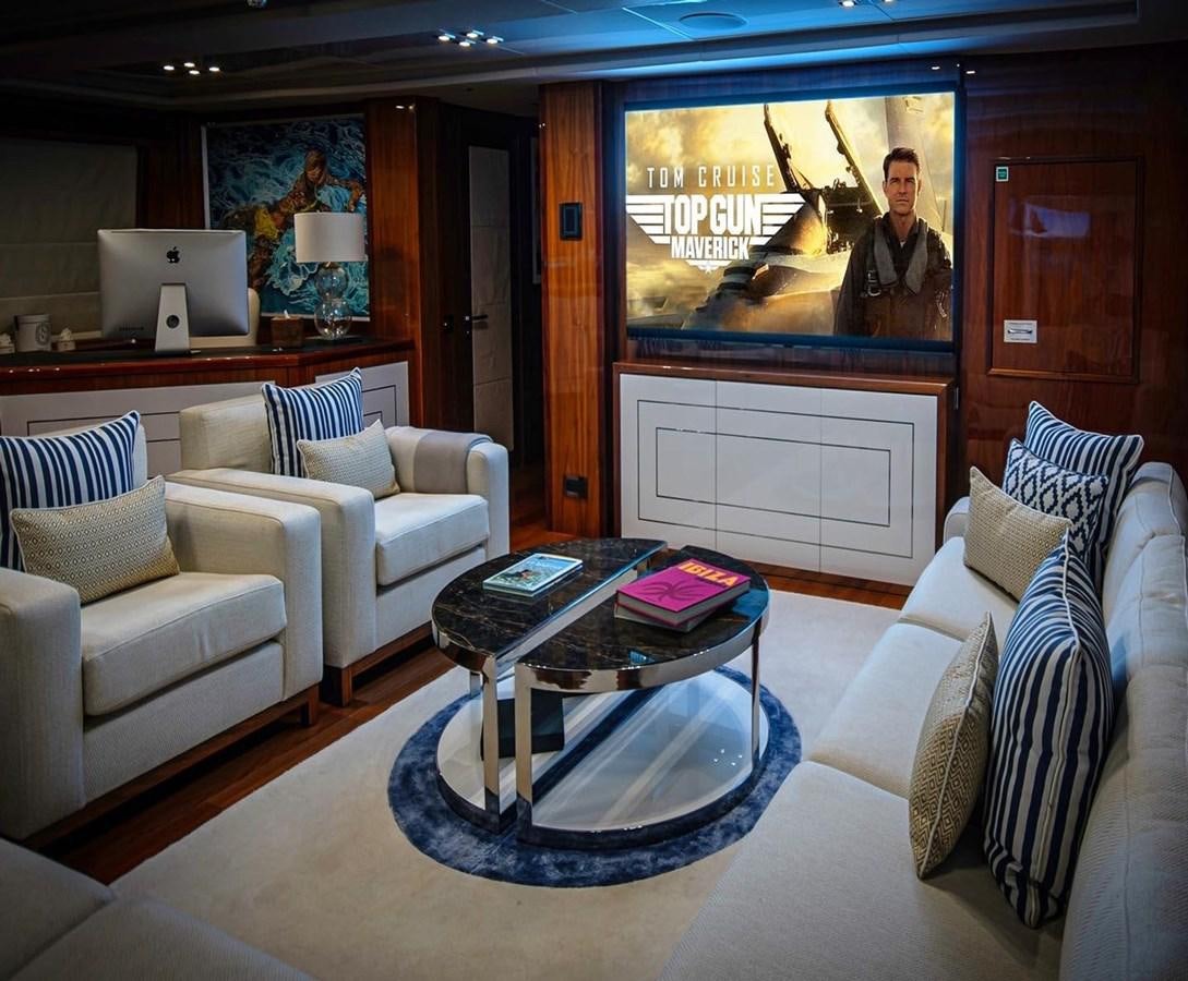 a living room with a large screen aboard ANYA Yacht for Sale