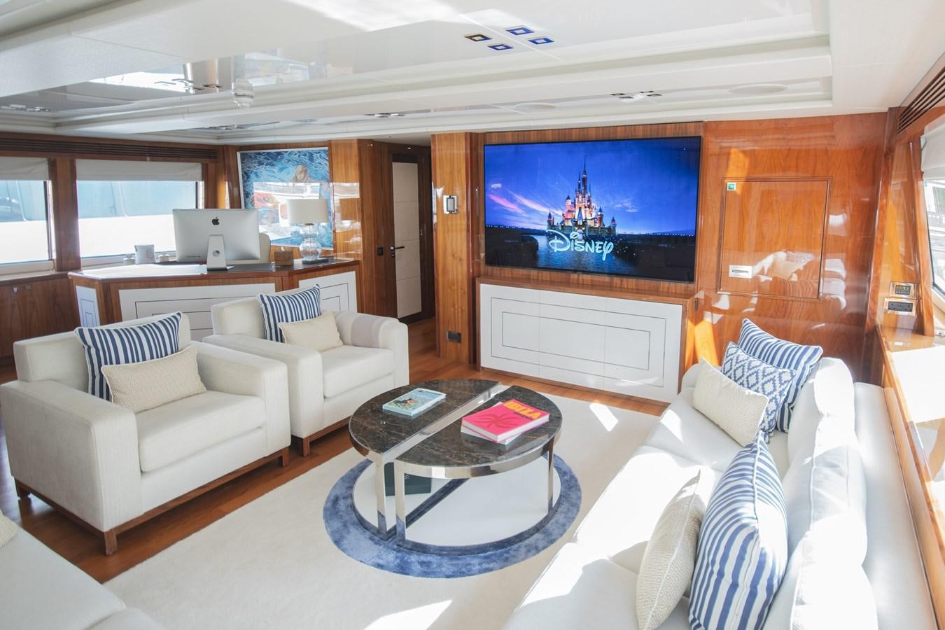 a living room with a large screen aboard ANYA Yacht for Sale